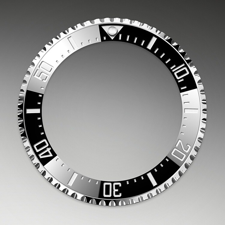 The 60-minute graduated, unidirectional rotatable bezel of the Rolex Deepsea enables divers to precisely and safely monitor their dive and decompression times. It is equipped with a patented black Cerachrom bezel insert manufactured by Rolex in a virtually scratchproof ceramic whose colour is unaffected by ultraviolet rays. The graduation is coated via PVD (Physical Vapour Deposition) with a thin layer of platinum. The sleek black dial features large Chromalight hour markers and hands, filled with luminescent material that emits a long-lasting blue glow for excellent legibility in dark conditions.