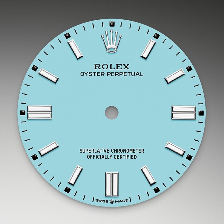 This bold, vivid tone is thanks to exceptional in-house expertise at Rolex, where craftsmanship rhymes with high technology. The colours created for the Oyster Perpetual range start life as a lacquer, which must be meticulously applied in a controlled-atmosphere environment to avoid dust and other contamination. The brass plate of the dial base receives layer upon layer of lacquer, six in all, to form a regular, uniform surface. The last step is varnishing and polishing to bring out the full brilliance and depth of colour. The various inscriptions are then pad printed, and the hour markers and crown riveted by hand. The dial, gleaming in its perfection, is all set to take its place on top of the movement at the watch assembly phase.