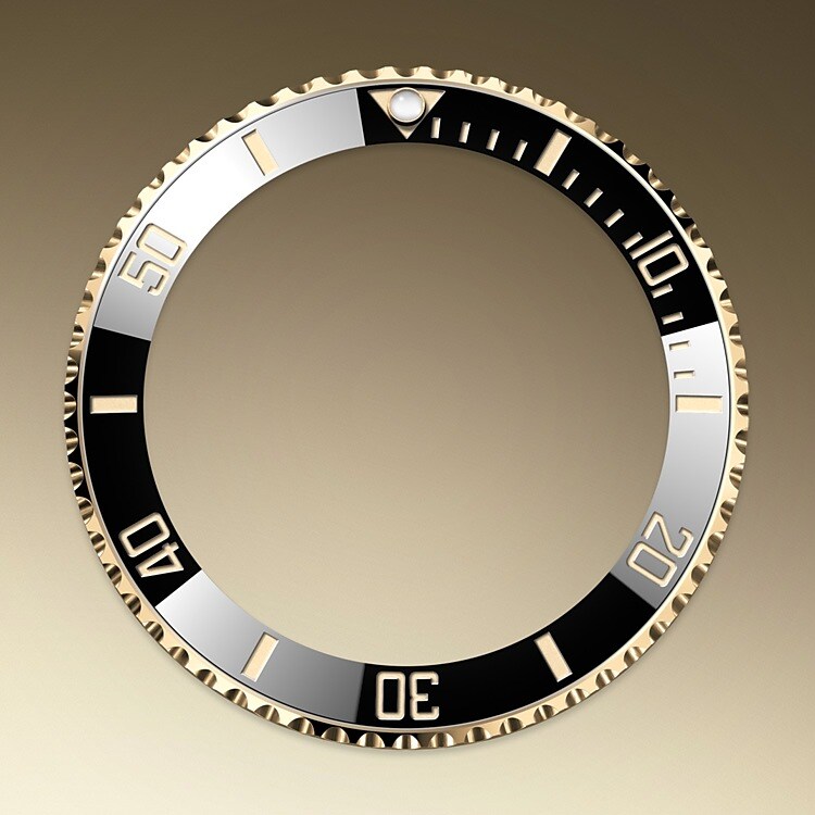 The Submariner's rotatable bezel is a key functionality of the watch. Its 60-minute graduations allow a diver to accurately and safely monitor diving time and decompression stops. Manufactured by Rolex from a hard, corrosion-resistant ceramic, the Cerachrom bezel insert is virtually scratchproof. A luminescent capsule on the zero marker ensures legibility, no matter how dark the environment. The bezel’s knurled edge is carefully designed to offer excellent grip under water, even with gloves.